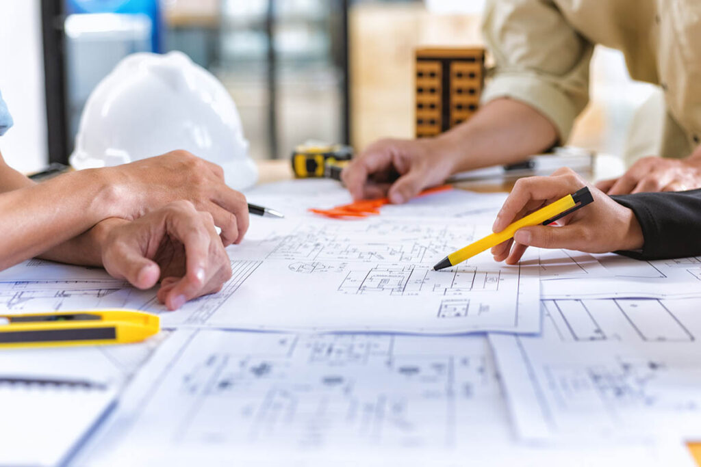 People looking at blueprints