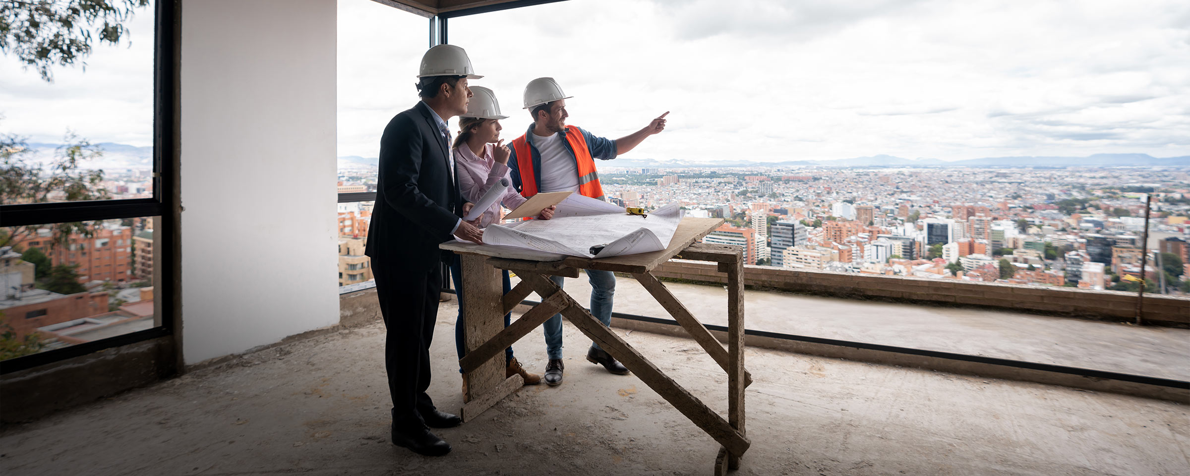 Structural engineers looking out over a city