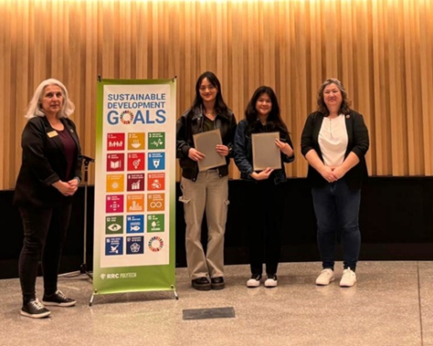 From left: Maria Mendes, Director of Environmental Stewardship and Campus Renewal, Alyssa Gayot and Mary Torrefalma, winners of the Top Applied Research Entry, and Kathleen Tiede from event sponsor Crosier Kilgour